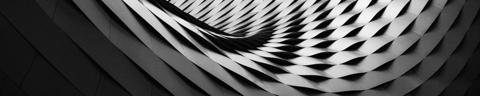 Curved black and grey roof tile structure